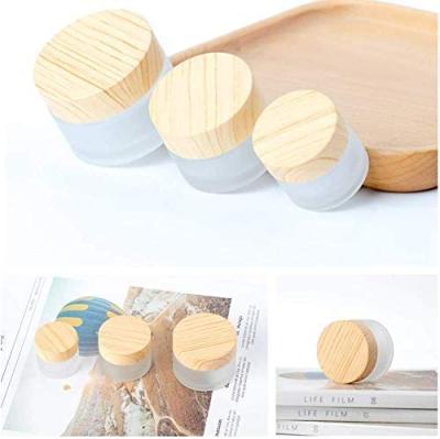 China 10 g /10 ml Glass Cosmetic Empty Frosted Cosmetic Cream Jar With Wood Grain Lid For Face Cream And Lip Balms for sale