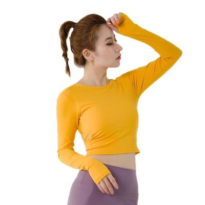 China 2020 Wholesale Fashion Breathable Beauty Long Sleeve Quick Dry Tops Back Long With Chest Cushion Women Sport Fitness Yoga Top GYM Routine Wear for sale