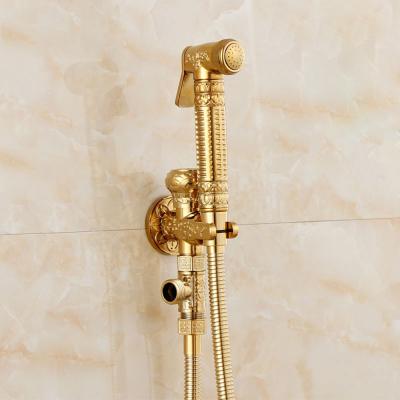 China Contemporary Wholesale And Retail Polished Embossed Toilet Sprayer Bathroom Broom Hand Shower Faucet Solid Brass Gold Finish Bidet Faucet for sale