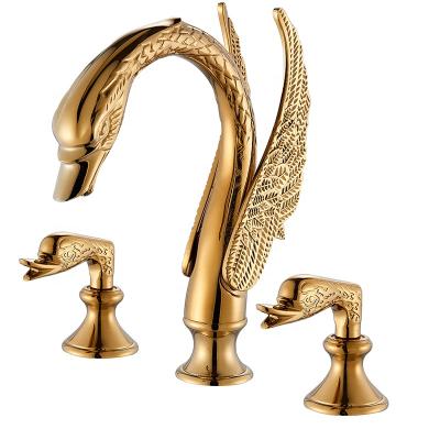 China 2019 New Arrivals Gold Faucets Metered Luxury Swan Faucet Deck Mounted Hot Cold Water Mixer Tap Bathroom Basin Sink Faucet Double Handles for sale