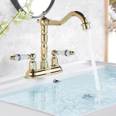 China Ceramic Contemporary Double Handle Basin Faucet Gold Bathroom Faucets Deck Mounted Swivel Spout Hot Cold Water Mixers Faucet for sale