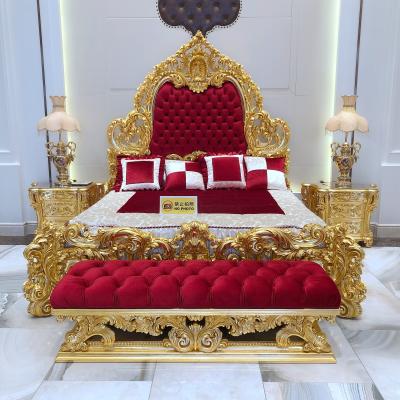 China 24K Real Gold Baroque Expensive Wooden Hand Carved Furniture Royal Gold Plated Bedroom Set With Red Fabric Headboard for sale