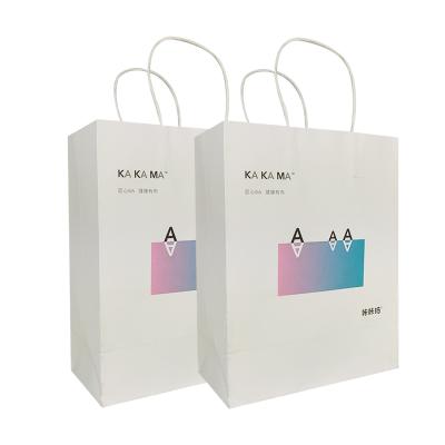 China Recyclable Custom Eco - Friendly Paper Gift Bags Printed White Portable Kraft Paper Shopping Bag With Twist Handle for sale