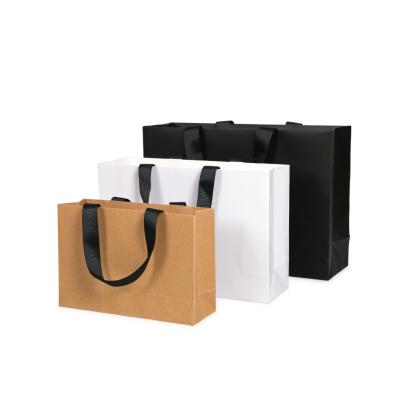 China Custom Made Recyclable White Paper 250g Gift Handle Shopping Bag With Ribbon Your Own Logo Printed Beautiful Party Paper Bag for sale