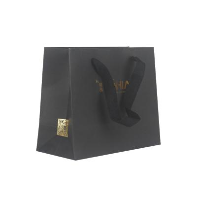 China Customized Buying Customized Embossing Fabric Gold Foil Life Sizes Hot Stamping Black Paper Bag for sale