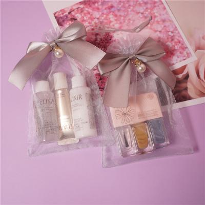 China Sample Gift Customized Logo Cosmetics Organza Bag for sale