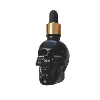 China NEW DESIGN 60ml Luxury Apperance Skull Glass Perfume Bottle Skull Glass Bottle Fragrance for sale