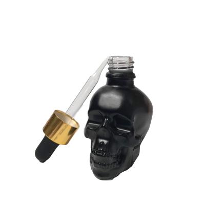 China Hot Sale Black Dropper Bottle Skull Shape Bottle Empty Personal Care Glass Bottle Te koop