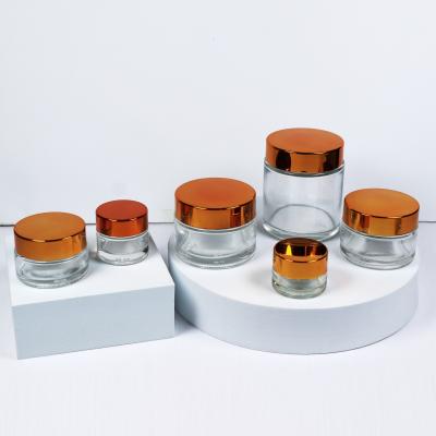 China Cosmetics Cream Jar 30ml 50ml 60ml 100ml Low Price Glass Cream Jar Metal Luxury Cream Lid Pretty Cosmetics à venda