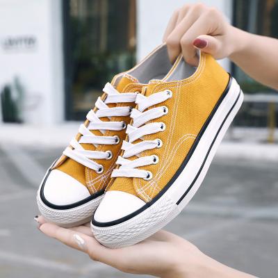 China Factory Lightweight Bulk Cheap Price Canvas Shoes Simple White Classic Lace Up Canvas Shoes For Unisex for sale