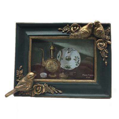 China Modern Custom Green Photo Frame for Home Decor Bird Design Resin Photo Picture Frame for sale