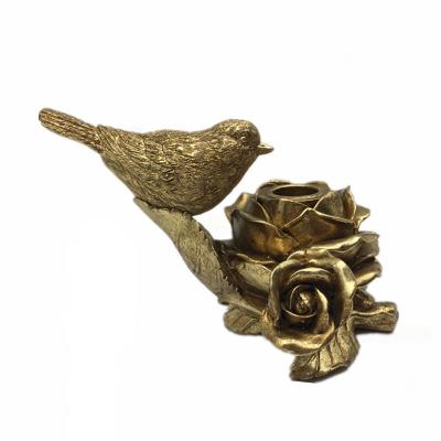 China Exquisite Home Decoration Table Central Decoration Resin Rose and Bird Design Gold Candle Holder Candleholder for sale