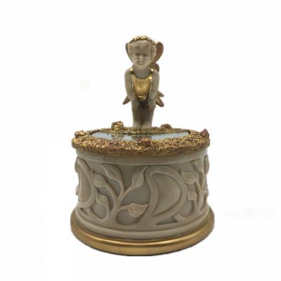 China Custom Decorative Cute Angel Gold Round Storage Jewelry Box Resin Indoor Jewel Case Home Decor Table Decorative Storage Box for sale