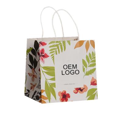 China Recyclable Manufacturing Custom Logo Recycled Twisted Kraft Paper Food Cake To Carry Paper Bag for sale