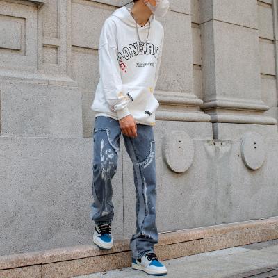 China QUICK DRY High Street splicing Vive style straight tube loose rock renaissance jeans men paint jeans men for sale