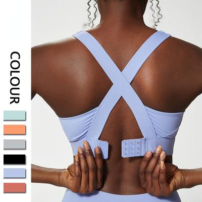 China Antibacterial Plus Size Solid Color Crossed Adjustable Strap Sports Bra Nylon Spandex Moisture Wicking Women Sexy Soft Quick Dry Top for sale