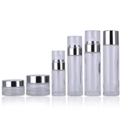 China Cosmetic Empty Sets Clear Frosted Glass Cream Jar With Silver Lid Glass Bottle For Cosmetic Toner Lotion Packaging for sale