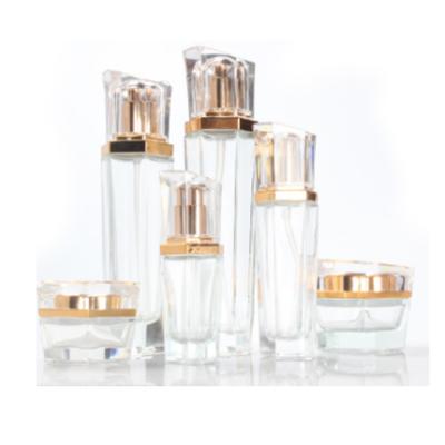 China Luxury Cosmetic Skincare Packaging Set Clear Cosmetic Glass Lotion Pump Bottles Container And Cream Jars for sale