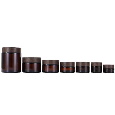 China Factory Wholesale Cosmetic Custom Round Shape Brown Amber Glass Cosmetic Face Eye Cream Jar With Dark Bamboo Lid for sale