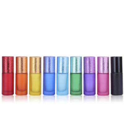 China 5ml Cosmetic Colored Wire Drawing Cap Ball Bottles Glass Roller Bottles for sale