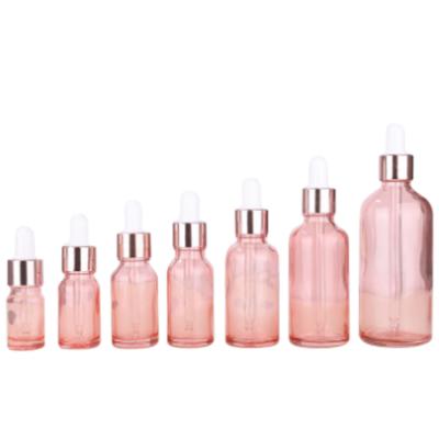 China Cosmetic white dropper bottles with pink gold cover 5ml 10ml 15ml 20ml 30ml 50ml 100ml rose gold dropper glass bottle for sale