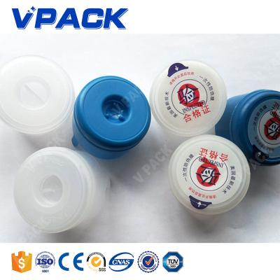 China Automotive adhesive sticker for 20L water bottle cap above glue waterproof film pp labeling machine linear type labeler for 56mm big lid for sale