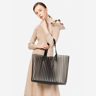 China 2020 NATIONAL OEM fashion trend clear transparent PVC tote shoulder bags with PU leather pocket for sale