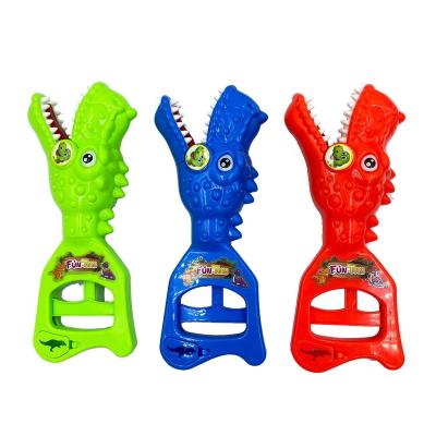 China Cartoon Toys Hand Plastic Dinosaur JollySweets Candy Toy Grabber Model Toy With Candy For Kids ABS Material High Quality Plastic for sale