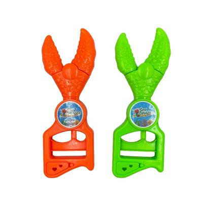 China Cartoon Toys Crab High Quality Funny Hand Gripper Toy Education Plastic Candy Toy With Hard Candy For Kids for sale