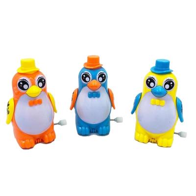 China Cartoon Toys Exquisite Plastic Cute Running Wind Cogs Penguin Laying Eggs Candy Toys Children's Favorite for sale