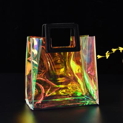 China 2021 New Style Fashion PVC Jelly Transparent Colorful Magic Handbag Laser Handbag Beach Plastic Bag for sale