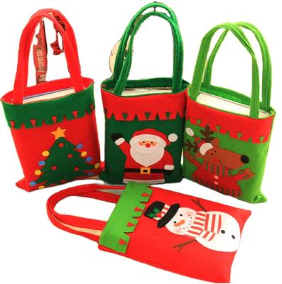 China Nonwoven Fabric Christmas Decorations Children's Gift Bags Hand Held Christmas Decorations Candy Gift Bags for sale