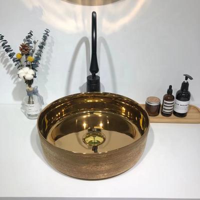 China Modern Countertop Ceramic Bathroom Sinks Gold Unique Meiyani Wash Basin for sale