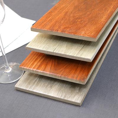 China Wholesale CLASSIC Popular Glossy Wood Look Stripe Texture Ceramic Floor Tiles for sale