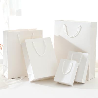 China Wholesale Fashion Customized Boutique Apparel White Shopping Gift Packaging Recyclable Coated Paper Bag for sale