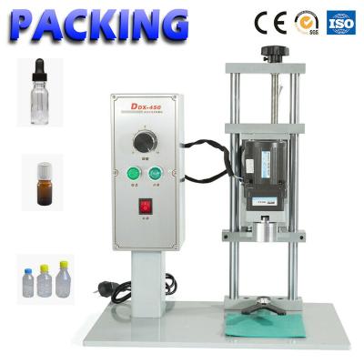 China DDX-450 Other Desktop Electric Bottle Ping Machine For Plastic / Glass Bottle Round Seal Screw Stable Bottles for sale