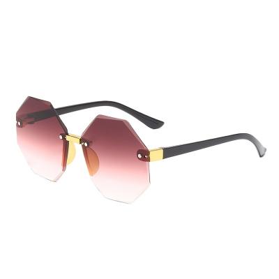 China Fashion Sunglasses Newly Kids High Quality Sun Glasses Wholesale Retro Girls Shape Polygon Rimless Frames UV Resistant Sunglasses for sale