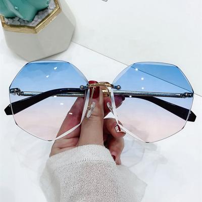 China Fashion Sun Glasses Women's Rimless Sunglasses Design Lady Sun Glass Vintage Alloy Designer Shades UV400 Classic Eyewear for sale