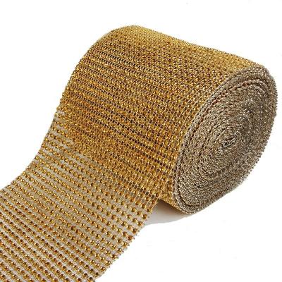 China Wholesale 24 Rows Gold Base 10 Yards Flatback/Roll Rhinestone Diamond Mesh Wrap Trimming Plastic Ribbon Sew On Mesh Trim for sale