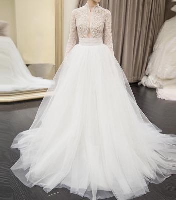 China 2022 Anti-Static Illusion Wedding Dresses High Neck Latest Arabic Beads Lace Up Tulle Long Sleeve Sexy Princess Wedding Bride Gowns New for sale