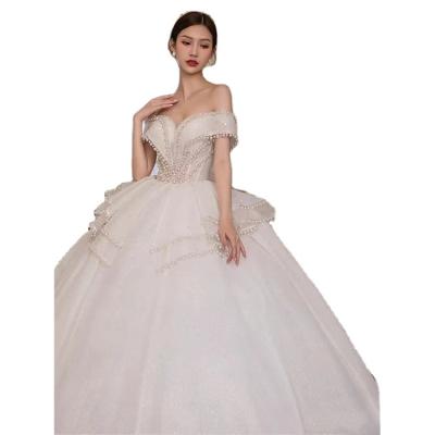 China New Breathable Luxury White V-Neck Wedding Dress Backless Shiny Sequin Off Shoulder Pearl Beading Princess Train Bride Gowns for sale