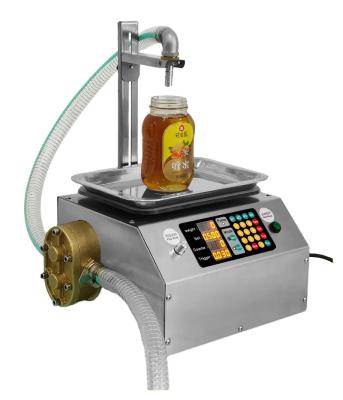 China Food Automatic weighing, honey filling machine, canning machine, feeder, oil machine, juice machine, glass bottle machine for sale