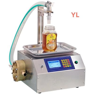 China Food Full Automatic Sub Weighing Filling Machine Honey Sesame Paste Edible Oil Glue Viscous Liquid,liquid filling machine for sale