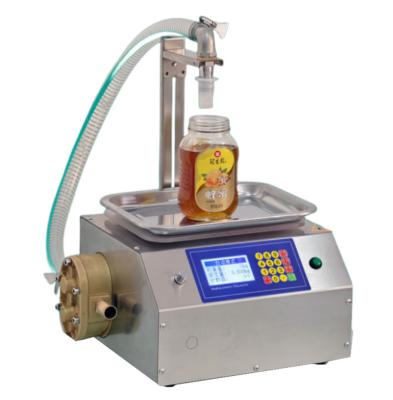 China Food manual paste weighing viscous liquid filling machine honey oil packaging machine factory price for sale