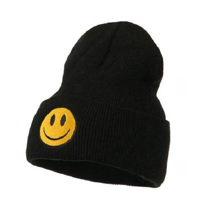 China COMMON 100% Acrylic Winter Knitted Beanie Hat Smiling Face Winter Hat for sale