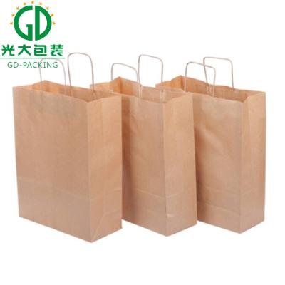 China Promotional wholesale china cheap kraft paper bag anticurl with handles for sale