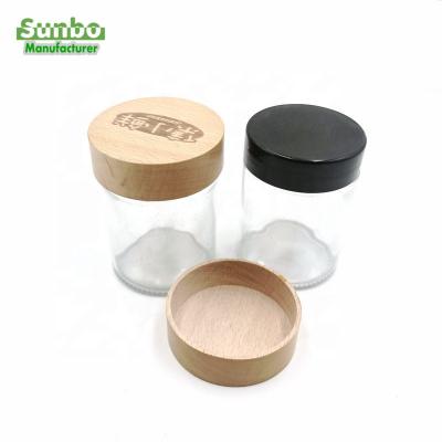 China Custom Pilfer Proof Beech Wood Cap With Gold Logo Storage Jar For Candle Glass Lid for sale