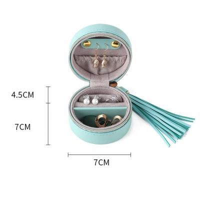 China Mini Portable Round Cylinder Organizer Travel Necklaces Earrings Rings Rings Jewelry Box With Tassel for sale