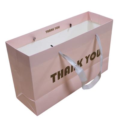 China High Quality Recyclable Luxury Design Gift Inventory Stock Paper Bag Shopping Bag With Pattern For Clothing for sale