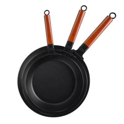 China Minimalist High Quality Carbon Steel Nitriding Frying Pan With Wooden Handle for sale